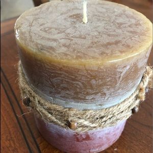 Earthy colors candle with rope and bead decoration